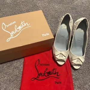 Christian Louboutin shoes size 38, slightly off white.